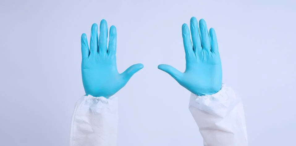 Empty two Back hand with blue gloves and PPE suite on white background. Stock Photos