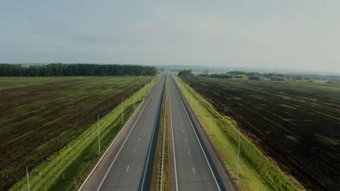 An empty two sided highway in the countryside. Stockbeeldmateriaal 156198258