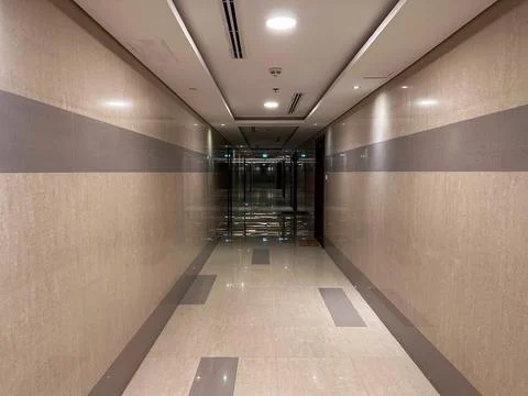 Empty underground corridor with artificial lighting Stock Photos