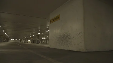 Empty underground parking garage with wall vandalized by skateboarders Video stock 105262319
