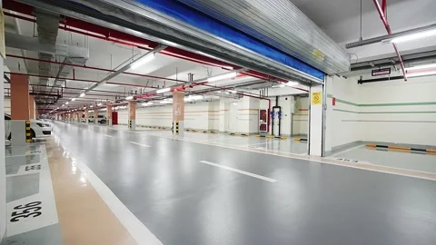Empty underground parking lot in new residential district Stock Footage 194889322