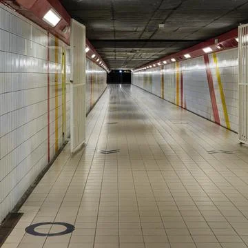Empty underground passage with symmetrical modern architecture Stock Photos