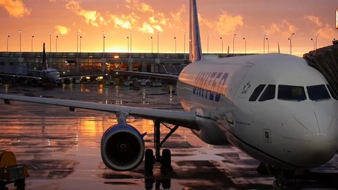 Empty United Airlines plane at sunset Stock Footage 128405937