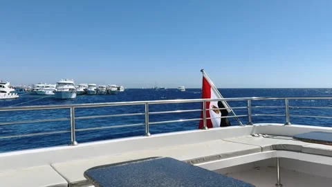 Empty upper yacht deck fenced safety stainless railing and Egyptian national Stock Footage 340947122