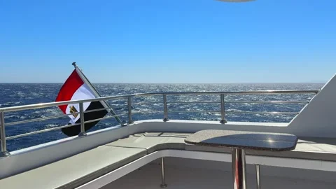 Empty upper yacht deck fenced safety stainless railing and Egyptian national Stock Footage 340948024
