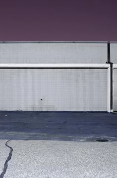 Empty Urban Wall with Tiled Facade and Asphalt Pavement Stock Photos
