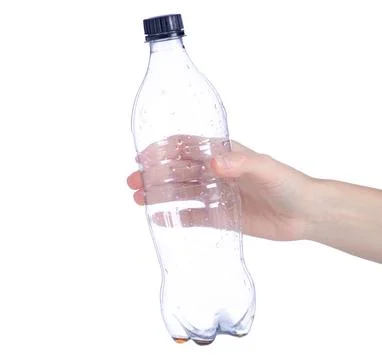 Empty used plastic bottle in hand Stock Photos