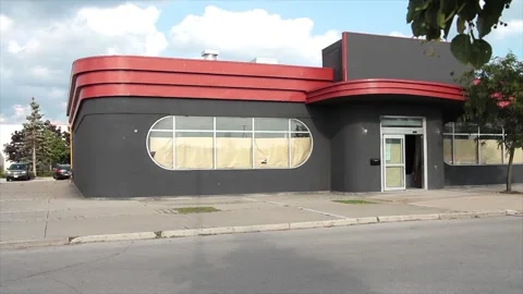 Empty vacant restaurant store storefront with windows covered from inside Stock Footage 249759142