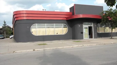 Empty vacant restaurant store storefront with windows covered from inside Stock Footage 249759174