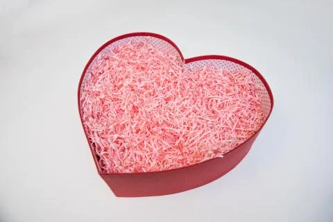 Empty valentine red heart-shaped gift box with pink paper decoration Stock-Fotos