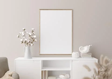 Empty vertical picture frame on cream wall in modern living room. Mock up int Foto stock