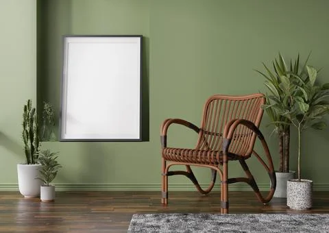 Empty vertical picture frame on green wall in modern room. Mock up interior i Stock Photos