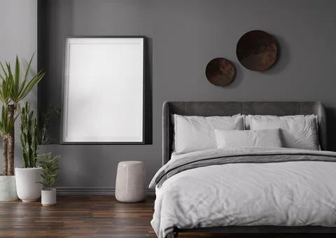 Empty vertical picture frame on grey wall in modern bedroom. Mock up interior Stock Photos