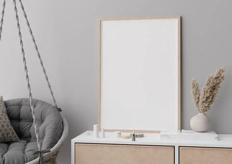 Empty vertical picture frame standing on console in modern room. Mock up inte Stock Photos