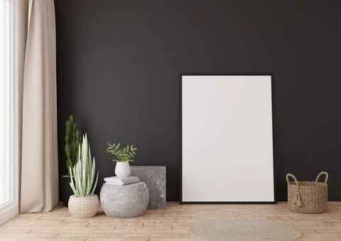 Empty vertical picture frame standing on parquet floor in modern living room. Stock Photos