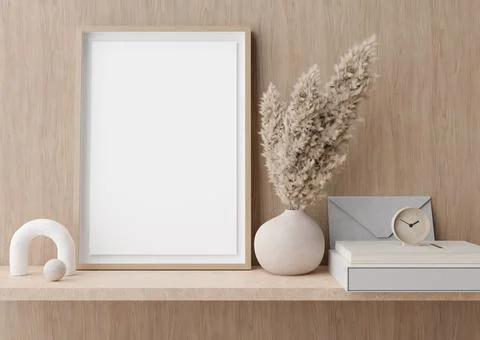 Empty vertical picture frame standing on shelve in modern room. Mock up inter Stock Photos