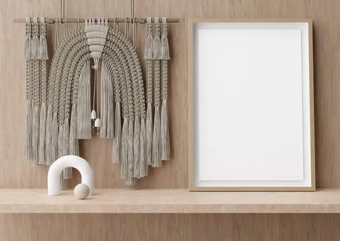 Empty vertical picture frame standing on shelve in modern room. Mock up inter Stock Photos