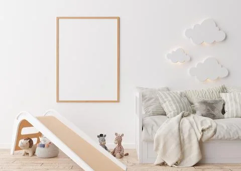 Empty vertical picture frame on white wall in modern child room. Mock up inte Stock Photos