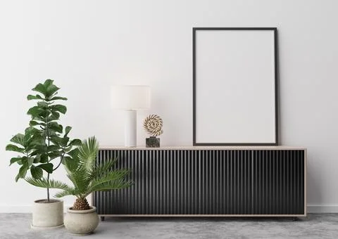 Empty vertical picture frame on white wall in modern living room. Mock up int Stock Photos