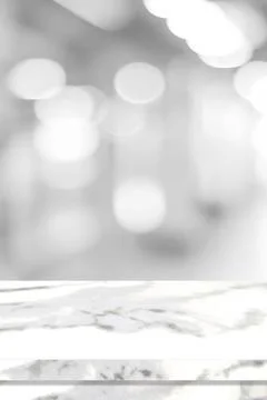 Empty vertical white table top, counter, desk over blur perspective store wit Stock Photos