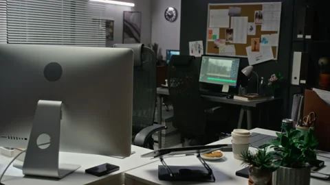 Empty Video Editing Studio Showing Computer Monitors at Night Stock Footage 348348023