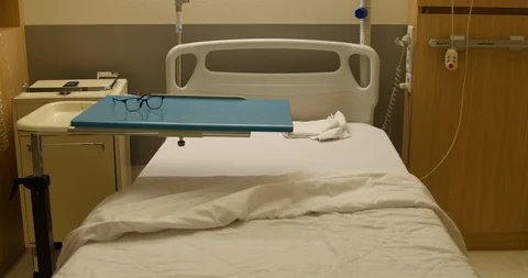 Empty view of medicalised bed for elderly during night. soft light and quiet Stock Footage 121164877
