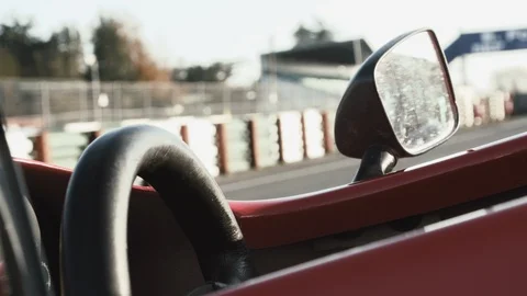 EMPTY VINTAGE FORMULA 1 CAR COCKPIT UNDER THE SUN Video stock 127405509