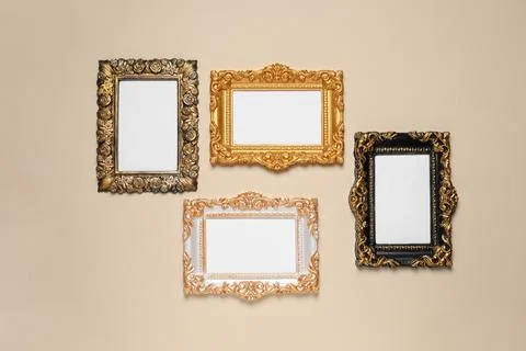 Empty vintage frames hanging on beige wall 写真素材