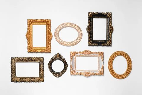Empty vintage frames hanging on white wall Stockfoto's