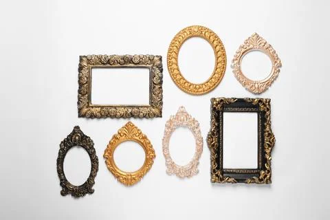 Empty vintage frames hanging on white wall Stock Photos