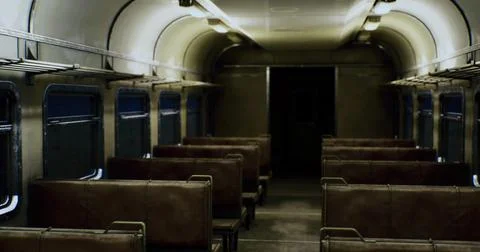Empty vintage train carriage creating a mysterious atmosphere Illustrazione stock