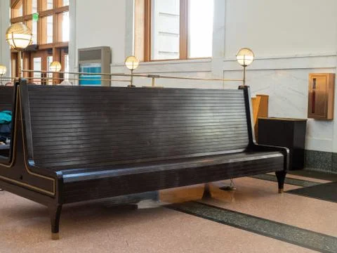 Empty waiting bench at train station terminal sitting near exit and entrance Stock Photos