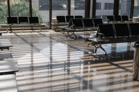 Empty waiting hall at airport or train station on sunny day. Concept of touri Stock Photos