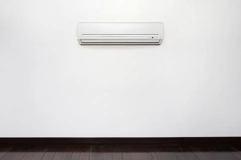 Empty wall mounted white color inverter air conditioner Stock Photos
