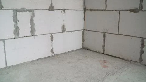 Empty wall. Rough concrete wall and floor. Empty space for your design. Renov Stock Photos