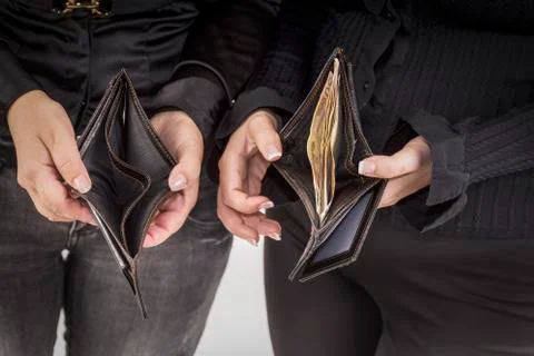 An empty wallet and full of banknotes Stock Photos