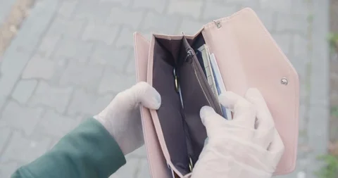 Empty wallet in hands in gloves street sidewalk beckground  covid 19 pandemic cr Vídeo Stock 127994445
