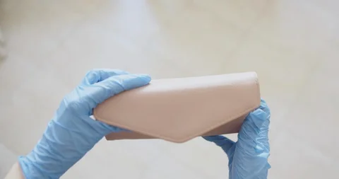 Empty wallet in hands in gloves white background covid 19 pandemic crisis Stock Footage 127996376