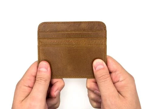 An Empty wallet in the hands of a man isolated on white background, wealth Stock Photos