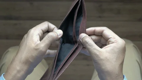 Empty wallet in the hands of an young man Stock Footage 127610784