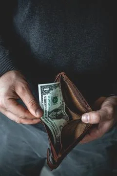 Empty wallet in the hands of a young man Foto stock