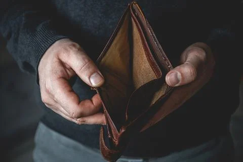 Empty wallet in the hands of a young man Stock Photos