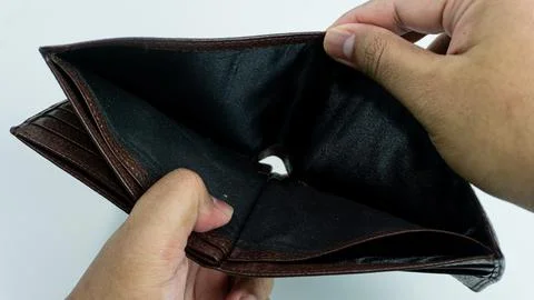 Empty wallet opened by hand isolated on white background Stock Photos