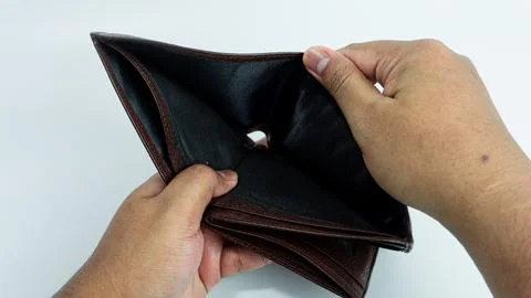 Empty wallet opened by hand isolated on white background Stock Photos