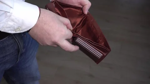 Empty Wallet: A Reflection on Financial Struggles Stockbeeldmateriaal 268352658