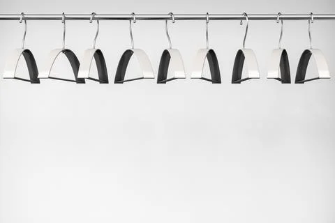 Empty wardrobe. Clothes hangers on the bar. Light style. Stock Illustration