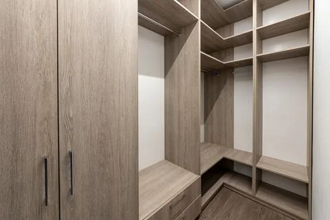 Empty wardrobe in dressing room. Large wardrobe room, with empty shelves. I.. Stock Photos
