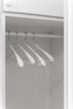 Empty wardrobe with hangers Stock Photos