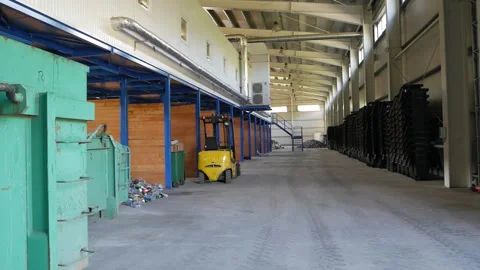 Empty warehouse interior with concrete floor and blue racks Video stock 313595454