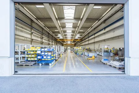 Empty warehouse interior with shelves, pallets , boxes and equipment Stock Photos